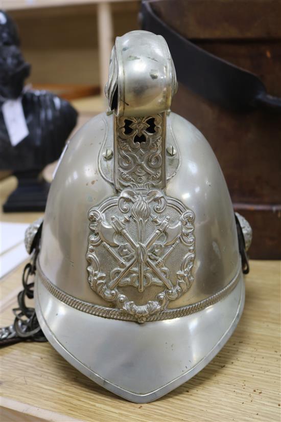 A firemans helmet and a leather belt